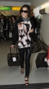 Cheryl_Cole_arriving_at_Heathrow_London_17_02_10_10.jpg