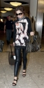 Cheryl_Cole_arriving_at_Heathrow_London_17_02_10_19.jpg