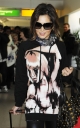 Cheryl_Cole_arriving_at_Heathrow_London_17_02_10_8.jpg