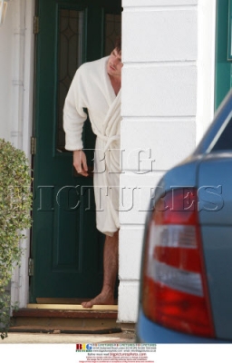 Mystery_man_in_a_white_robe_outside_Nadine_s_front_door_211108_28529.jpg