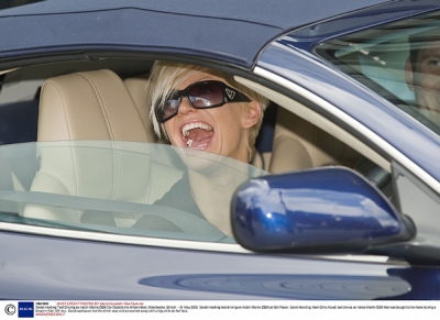 Sarah_Harding_test_driving_an_Aston_Martin_DB9_car_31_05_08_281229.jpg