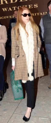Cheryl_Cole_and_Nicola_Roberts_arrive_back_at_Heathrow_airport_06_10_13_286129.jpg