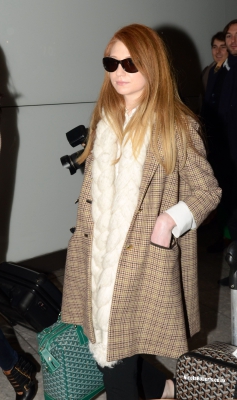 Cheryl_Cole_and_Nicola_Roberts_arrive_back_at_Heathrow_airport_06_10_13_286529.jpg