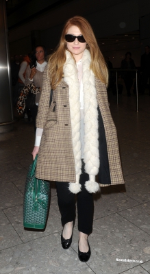 Cheryl_Cole_and_Nicola_Roberts_arrive_back_at_Heathrow_airport_06_10_13_286929.jpg