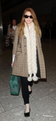 Cheryl_Cole_and_Nicola_Roberts_arrive_back_at_Heathrow_airport_06_10_13_287229.jpg