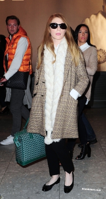 Cheryl_Cole_and_Nicola_Roberts_arrive_back_at_Heathrow_airport_06_10_13_287529.jpg