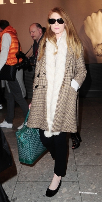 Cheryl_Cole_and_Nicola_Roberts_arrive_back_at_Heathrow_airport_06_10_13_287629.jpg