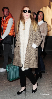 Cheryl_Cole_and_Nicola_Roberts_arrive_back_at_Heathrow_airport_06_10_13_287729.jpg
