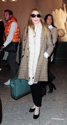 Cheryl_Cole_and_Nicola_Roberts_arrive_back_at_Heathrow_airport_06_10_13_287829.jpg