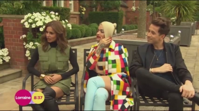 WATCH_Cheryl_Fernandez_Versini2C_Rita_Ora_and_Nick_Grimshaw_laugh_off_announcer_Pete_Dickson_quitting_mp40003.jpg
