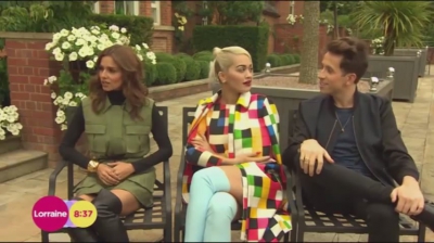 WATCH_Cheryl_Fernandez_Versini2C_Rita_Ora_and_Nick_Grimshaw_laugh_off_announcer_Pete_Dickson_quitting_mp40006.jpg