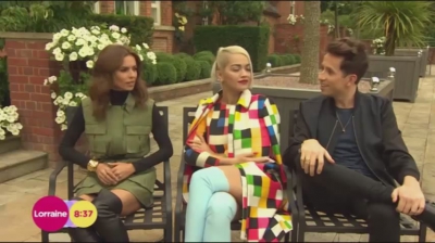 WATCH_Cheryl_Fernandez_Versini2C_Rita_Ora_and_Nick_Grimshaw_laugh_off_announcer_Pete_Dickson_quitting_mp40007.jpg