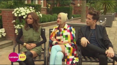 WATCH_Cheryl_Fernandez_Versini2C_Rita_Ora_and_Nick_Grimshaw_laugh_off_announcer_Pete_Dickson_quitting_mp40008.jpg