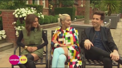 WATCH_Cheryl_Fernandez_Versini2C_Rita_Ora_and_Nick_Grimshaw_laugh_off_announcer_Pete_Dickson_quitting_mp40020.jpg