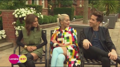 WATCH_Cheryl_Fernandez_Versini2C_Rita_Ora_and_Nick_Grimshaw_laugh_off_announcer_Pete_Dickson_quitting_mp40021.jpg